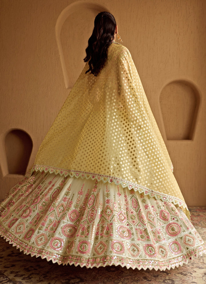 Ivory And Yellow Embroidered Tissue Lehenga