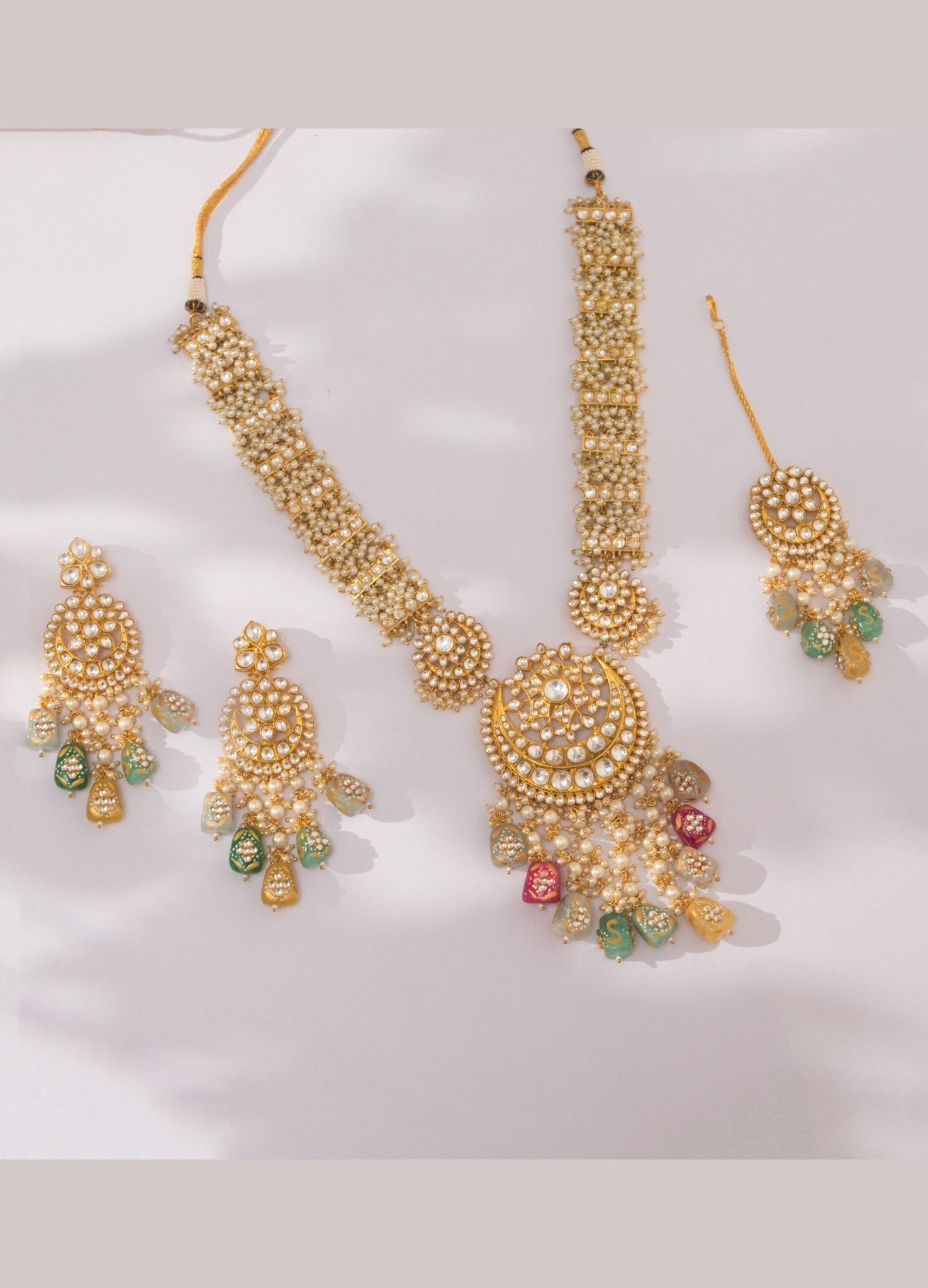Gold necklace set with maang tikka sales