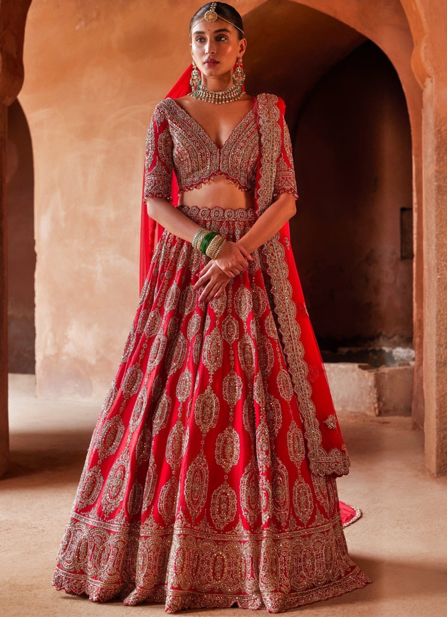 Scarlet Red Bridal Silk Lehenga With Gold Embellished Work