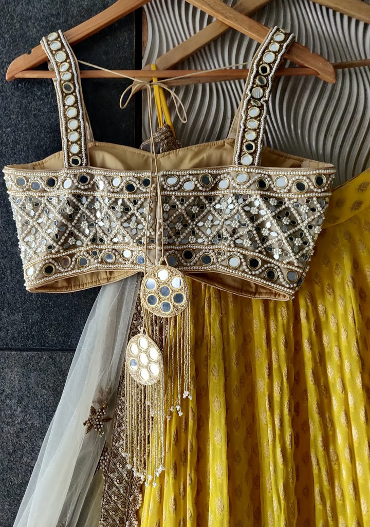 Sunshine Yellow Lehenga with Mirror work Bustier and Ivory Dupatta Priti Sahni - Fabilicious Fashion