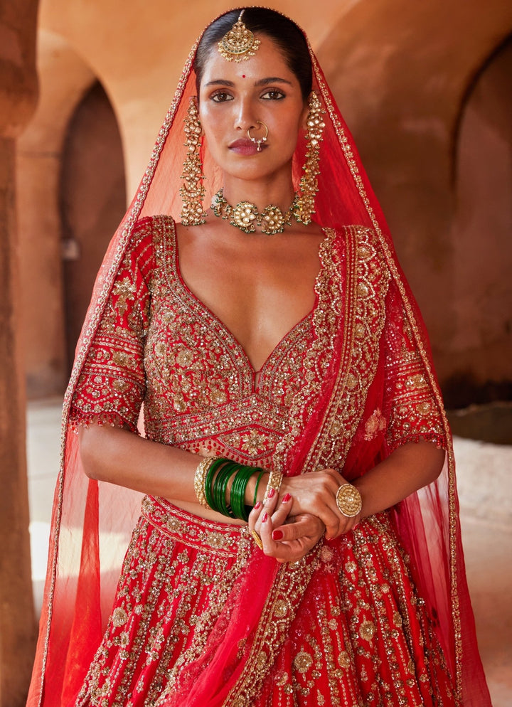 Vibrant Red Tasseled Bridal Silk Lehenga Set With Net Dupatta Nitika Gujral - Fabilicious Fashion