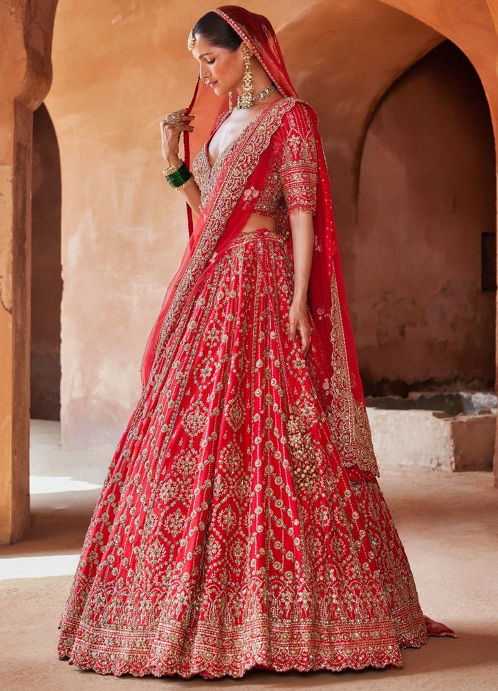 Vibrant Red Tasseled Bridal Silk Lehenga Set With Net Dupatta Nitika Gujral - Fabilicious Fashion