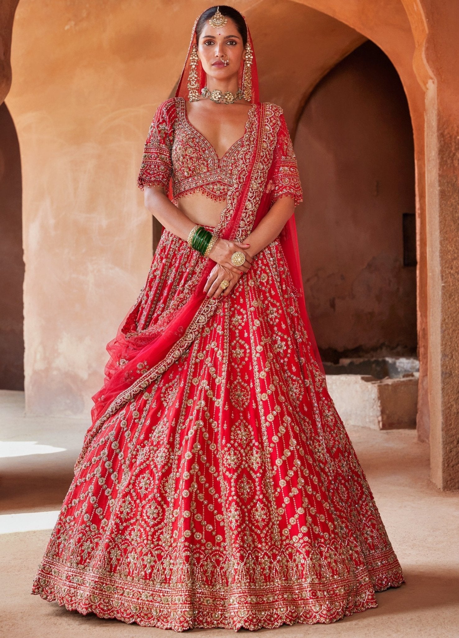Vibrant Red Tasseled Bridal Lehenga Set With Net Dupatta