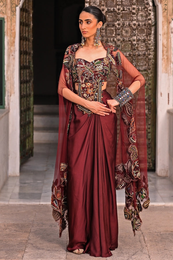 Juhi Bengani maroon red satin cowl skirt set with cape for a destination wedding sangeet