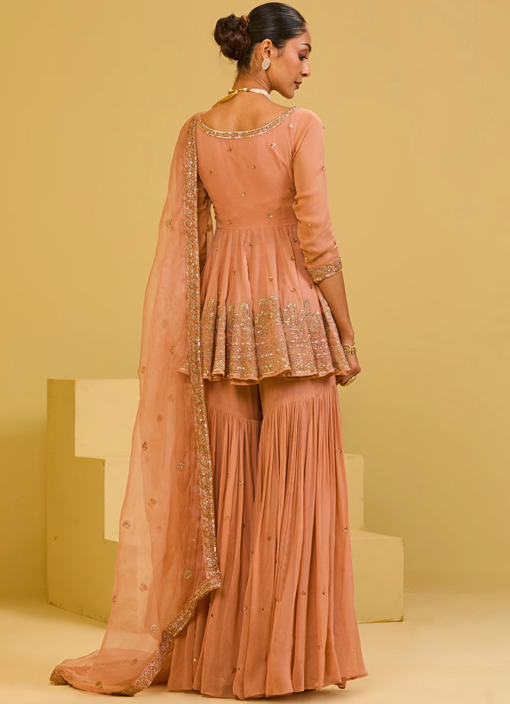 Muted Peach Georgette Peplum Kurta Sharara Set