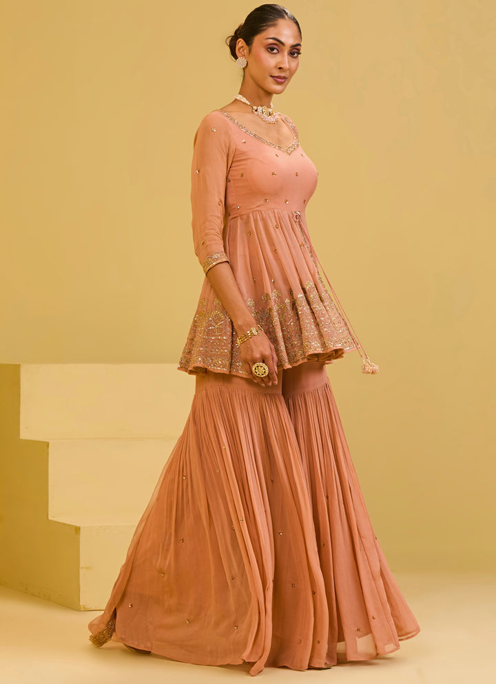 Muted Peach Georgette Peplum Kurta Sharara Set