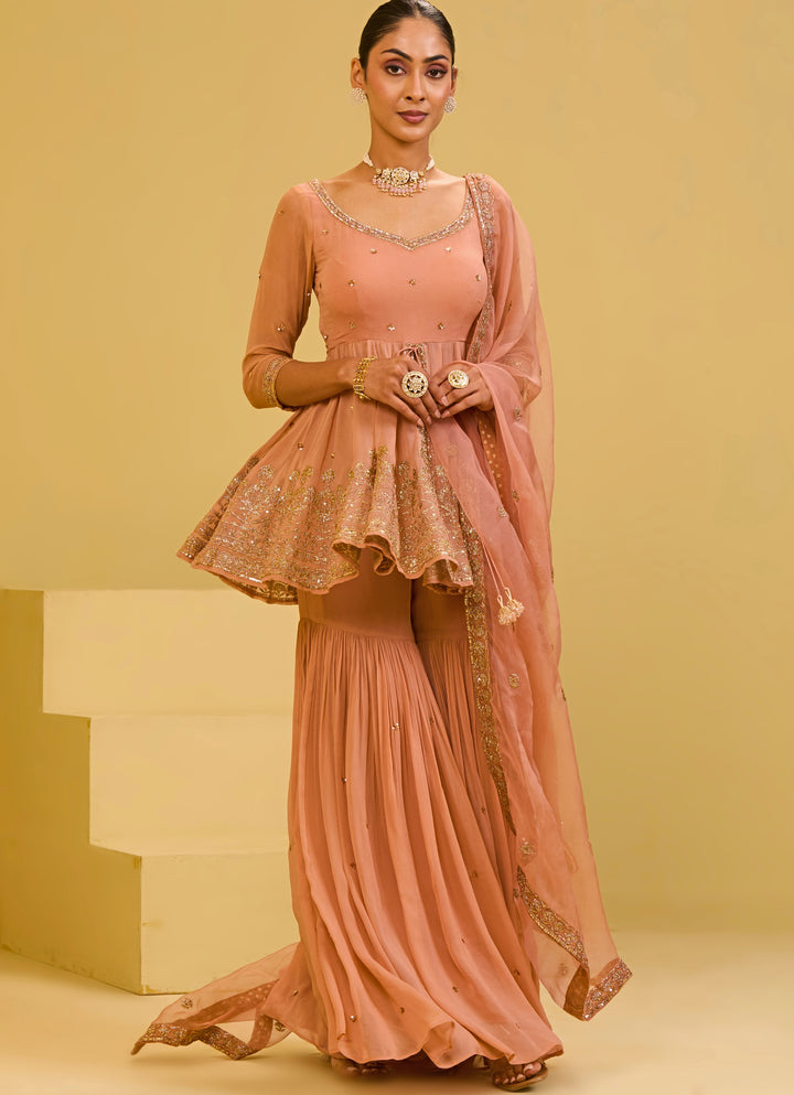 Muted Peach Georgette Peplum Kurta Sharara Set