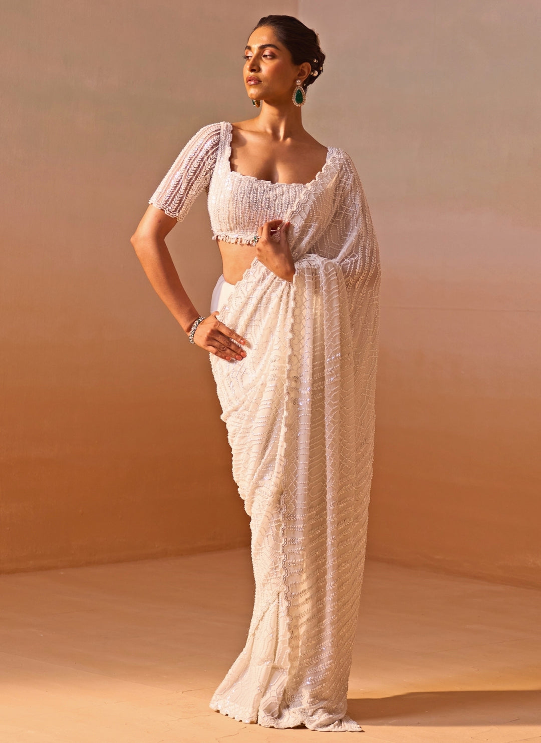 Ivory Georgette Saree With Sequins Blouse