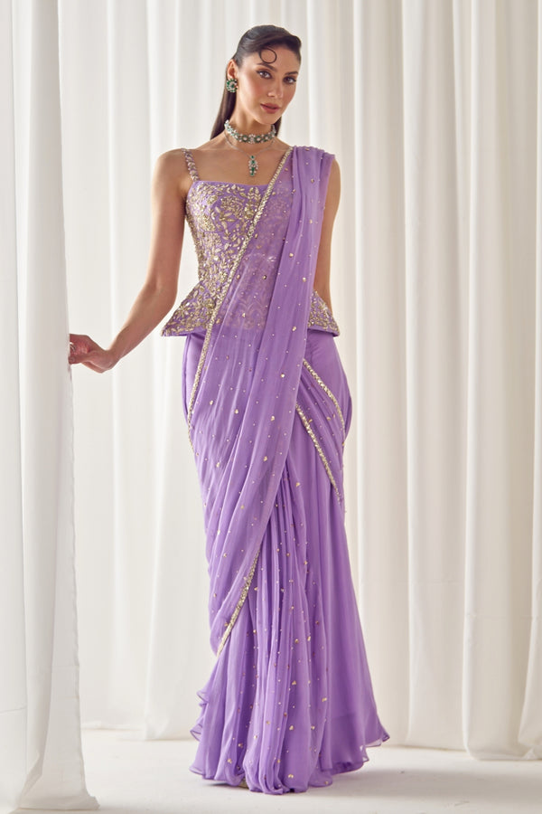 Lilac chiffon pre-draped saree with corset by Sanya Gulati