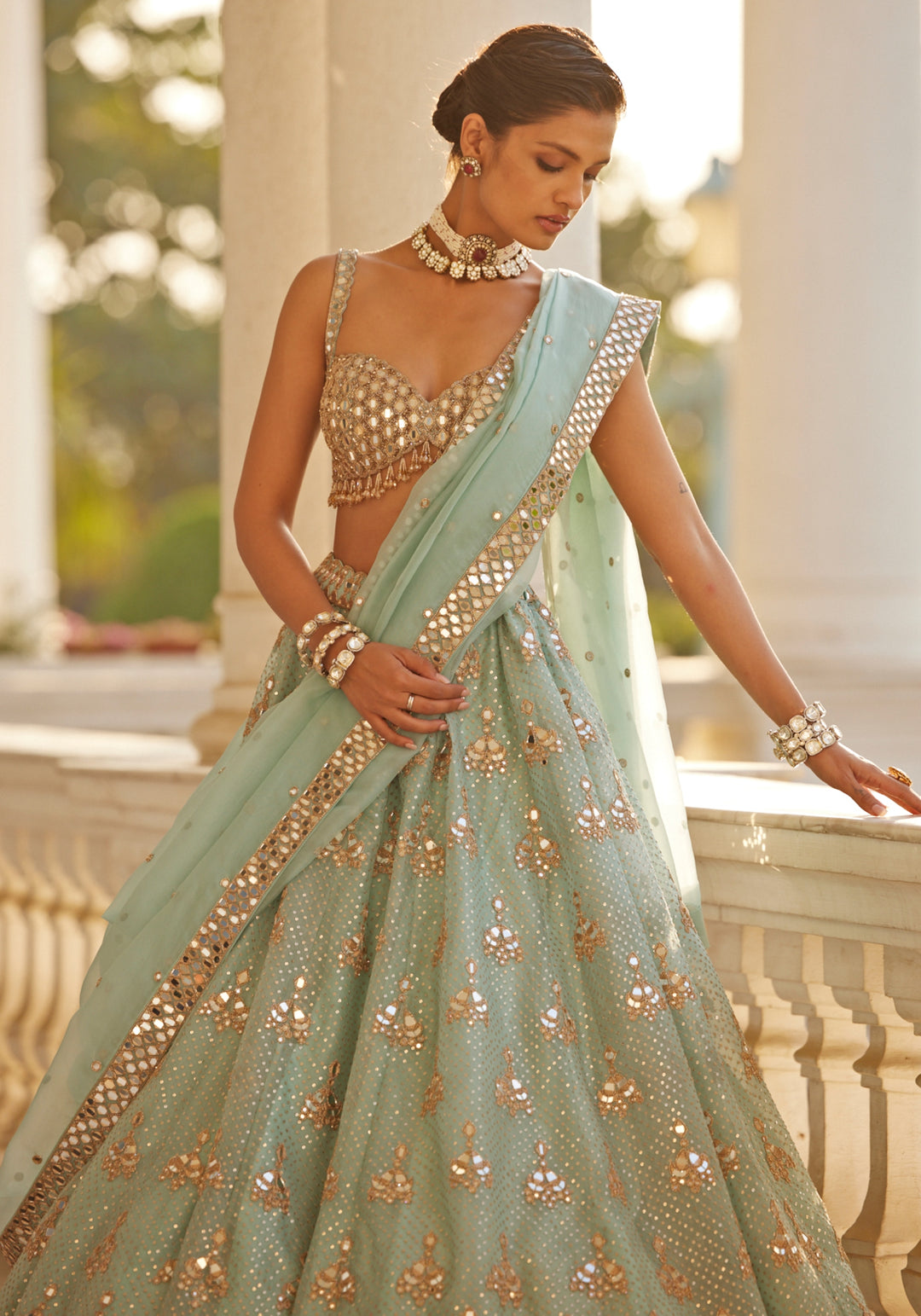 Powder Blue Organza Lehenga With Embroidered Sleeveless Blouse