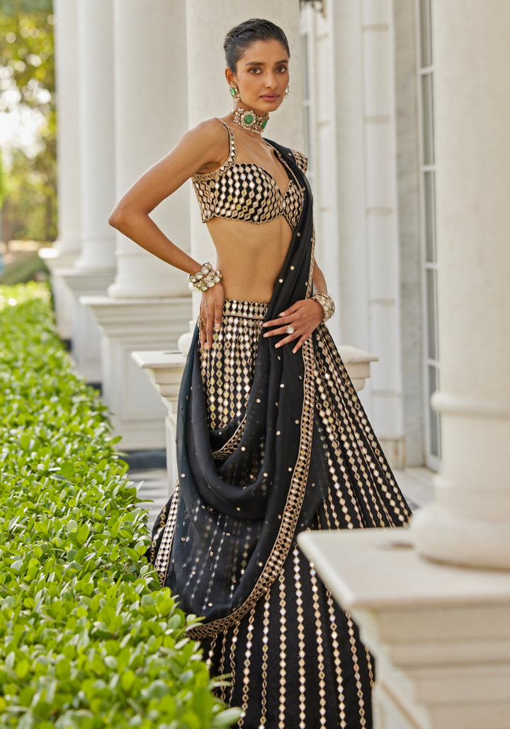 Black Linear Lehenga With Embroidered Sleeveless Blouse