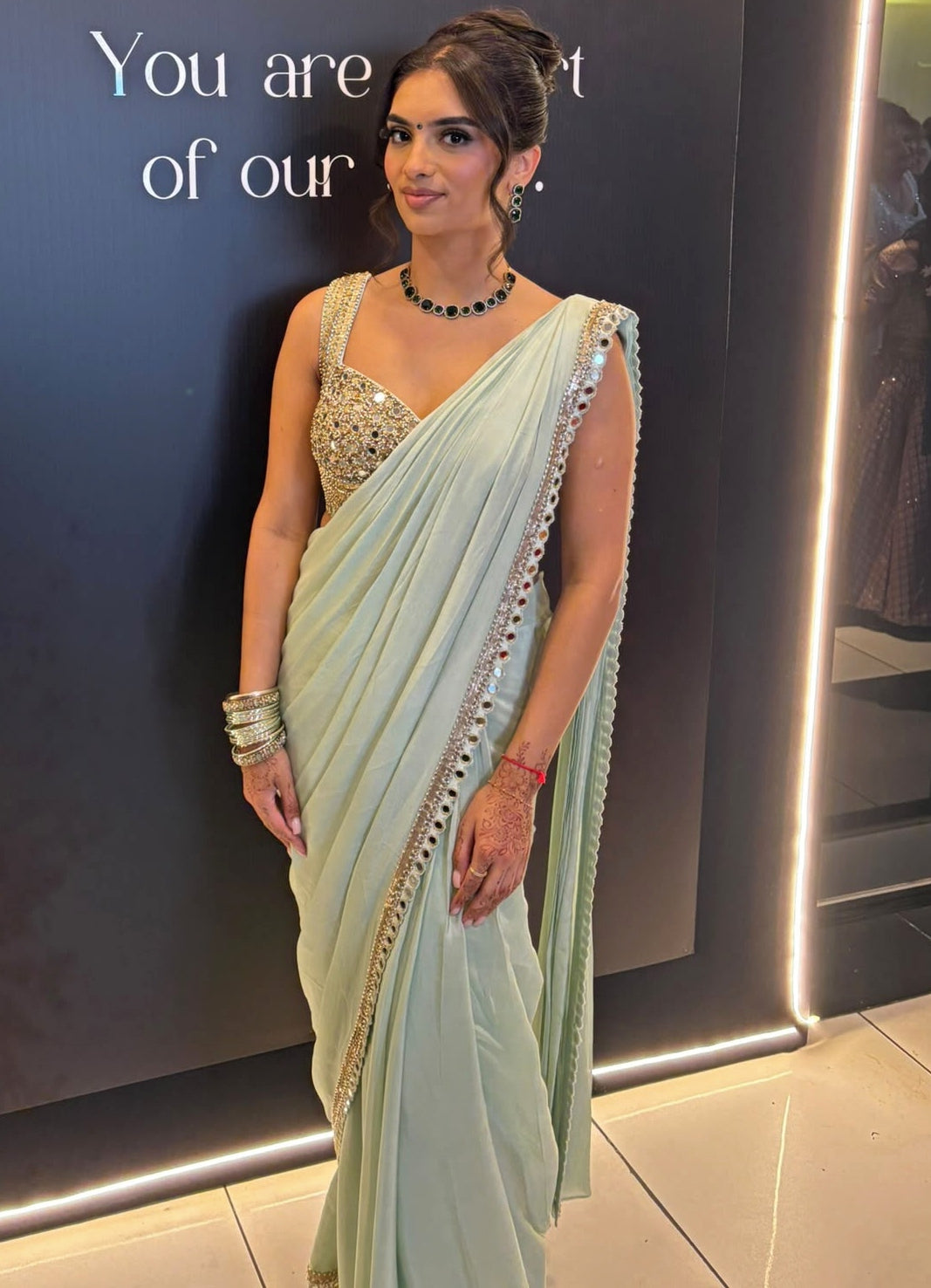Amba in her made-to-measure dusty green Nidhika Shekhar pre-draped saree at her brother's wedding