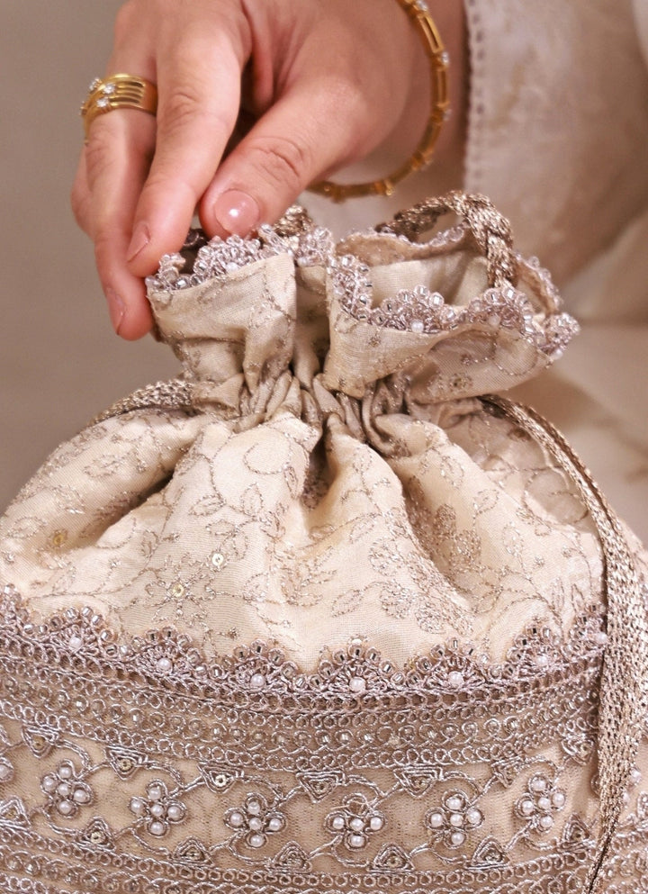 Amyra Beige Embroidered Tissue PotliFabilicious Fashion