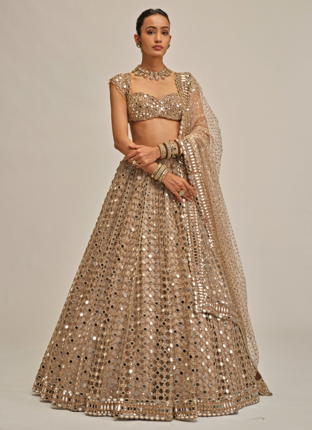 Beige gold mirror embroidered georgette lehenga by Vvani by Vani Vats