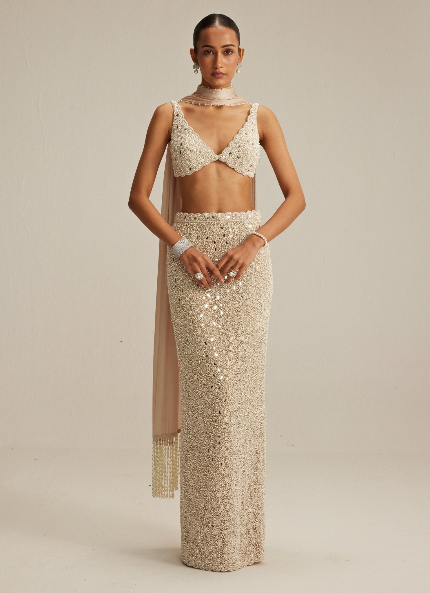 Beige gold pearl embroidered pencil skirt with V-neck blouse from the Vani Vats cocktail collection