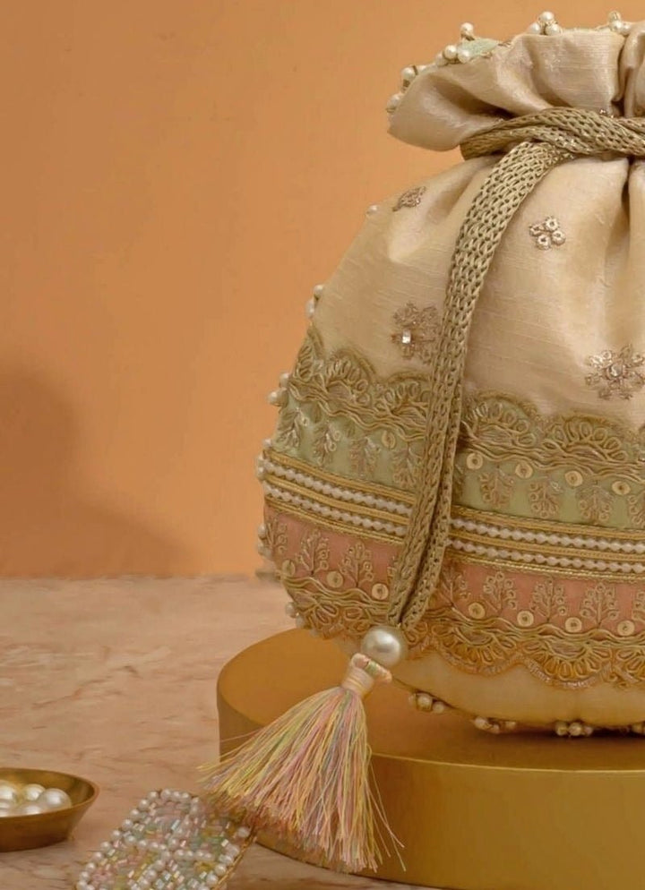 Amyra Beige Silk Potli With Mint Green And Pink WorkFabilicious Fashion