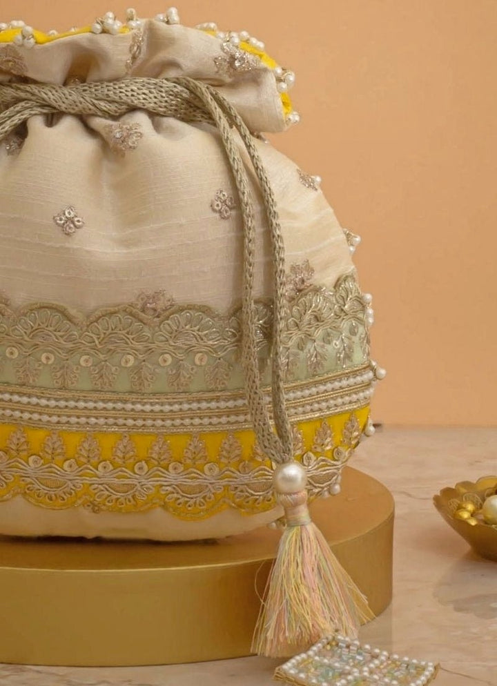 Amyra Beige Silk Potli With Mint Green And Yellow WorkFabilicious Fashion