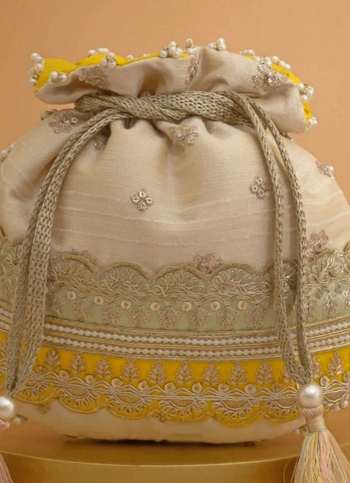 Amyra Beige Silk Potli With Mint Green And Yellow WorkFabilicious Fashion