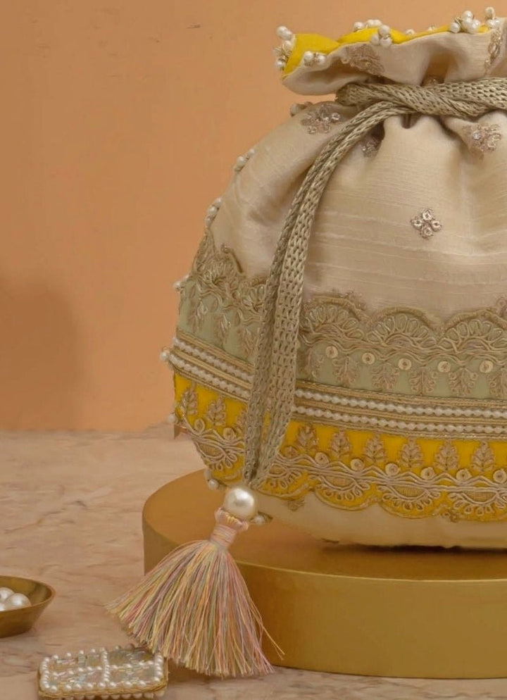 Amyra Beige Silk Potli With Mint Green And Yellow WorkFabilicious Fashion