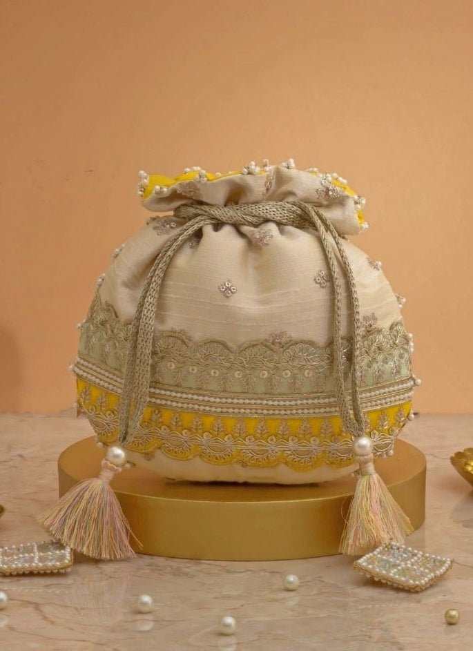 Amyra Beige Silk Potli With Mint Green And Yellow WorkFabilicious Fashion