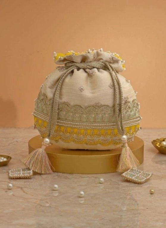 Amyra Beige Silk Potli With Mint Green And Yellow WorkFabilicious Fashion