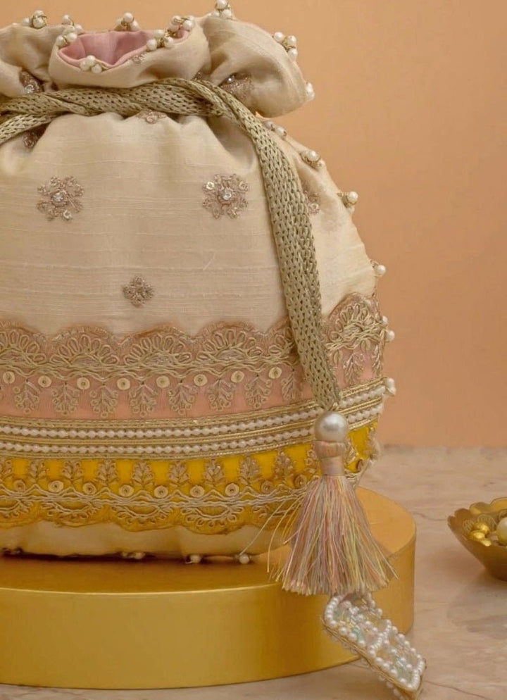 Amyra Beige Silk Potli With Pink And Yellow WorkFabilicious Fashion