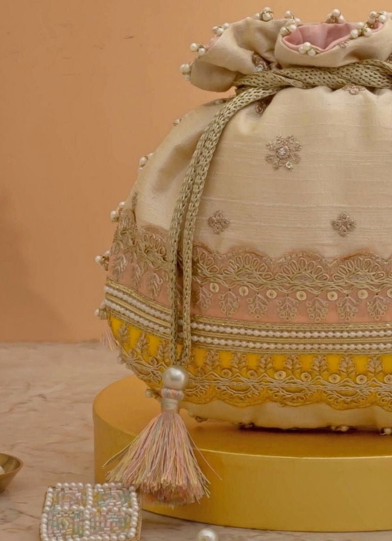 Amyra Beige Silk Potli With Pink And Yellow WorkFabilicious Fashion