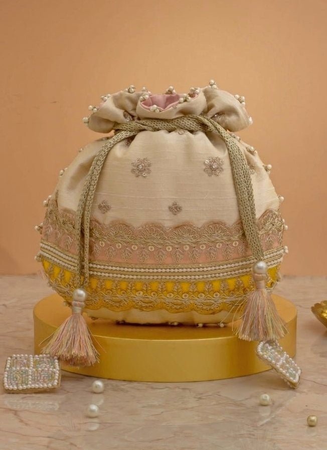 Amyra Beige Silk Potli With Pink And Yellow WorkFabilicious Fashion