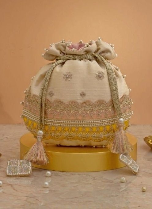 Amyra Beige Silk Potli With Pink And Yellow WorkFabilicious Fashion