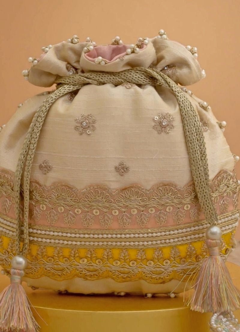 Amyra Beige Silk Potli With Pink And Yellow WorkFabilicious Fashion