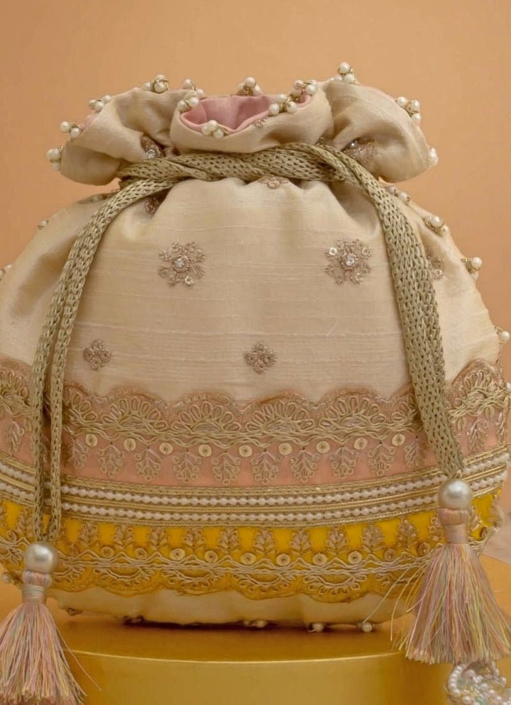 Amyra Beige Silk Potli With Pink And Yellow WorkFabilicious Fashion