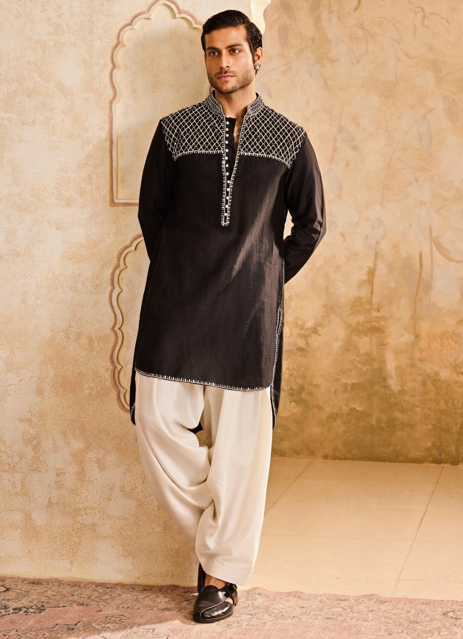 Black and white kurta set for wedding guests with contemporary silhouette