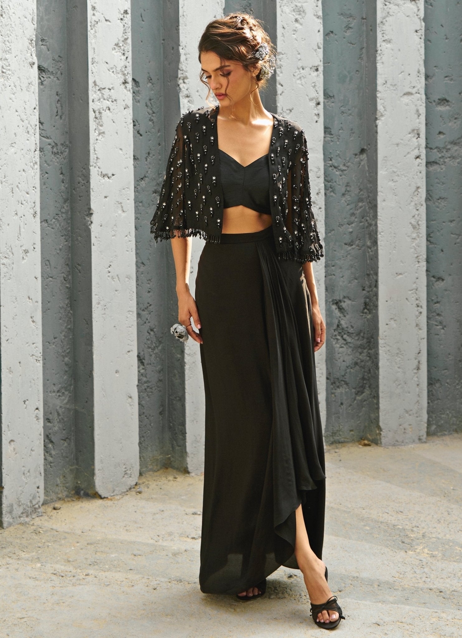 Black cape skirt set for evening wedding guest occasion by Chamee and Palak