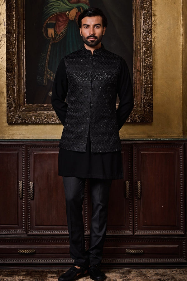 Black raw silk Nehru jacket set for men for an evening wedding by Nitika Gujral