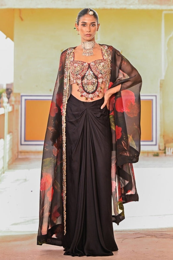 Juhi Bengani black satin cowl skirt set with cape for a cocktail night