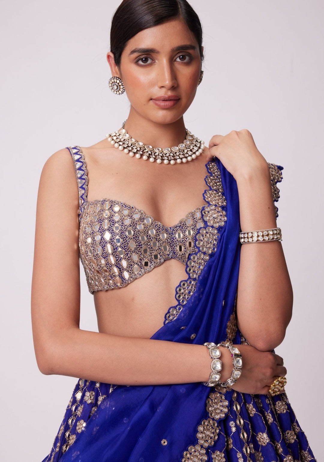 Blue Flower Embroidered Lehenga With Sleeveless Blouse Vvani by Vani Vats - Fabilicious Fashion