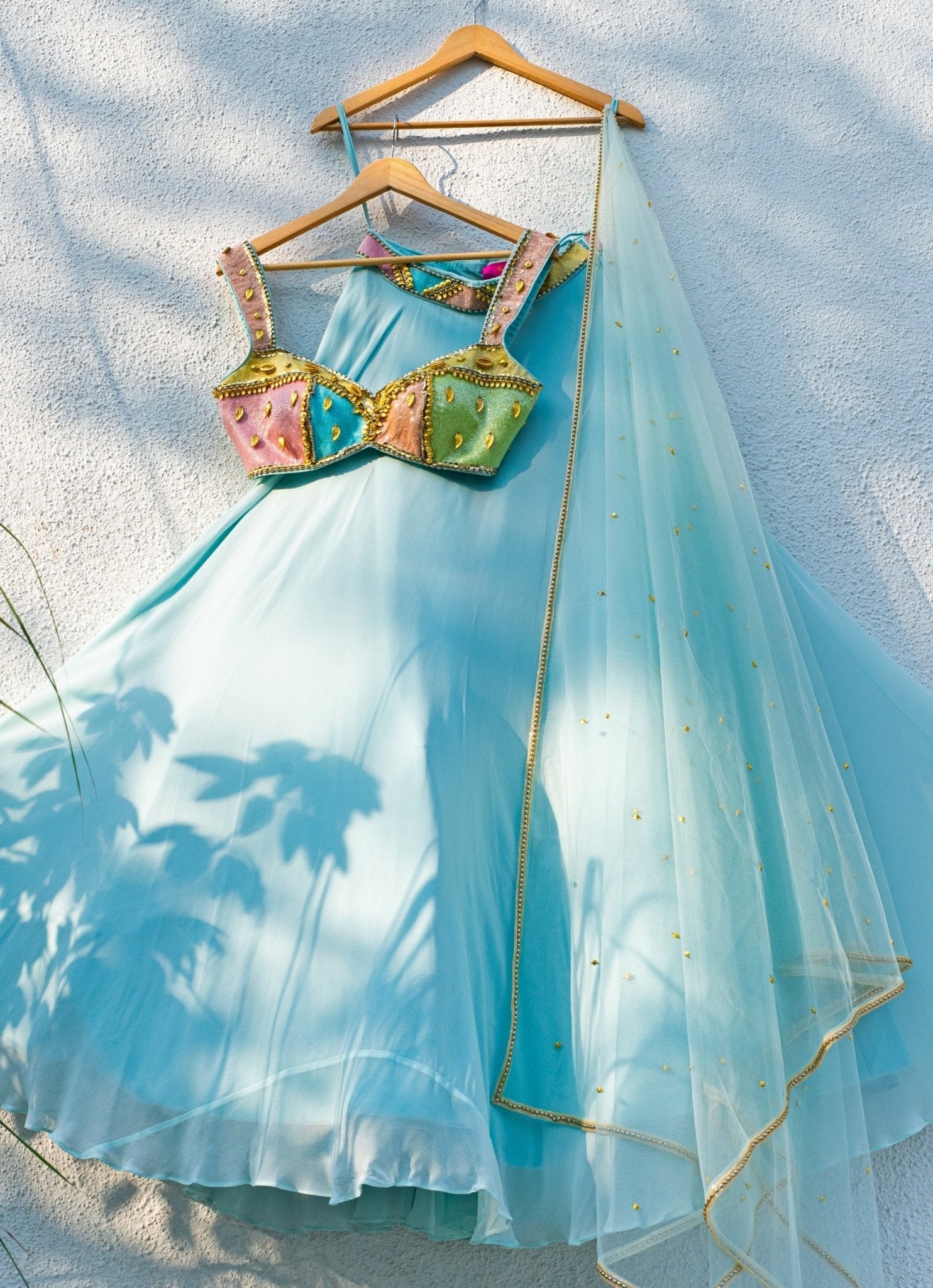 Blue georgette lehenga with multicolour blouse — wedding guest lehenga by Anisha Shetty