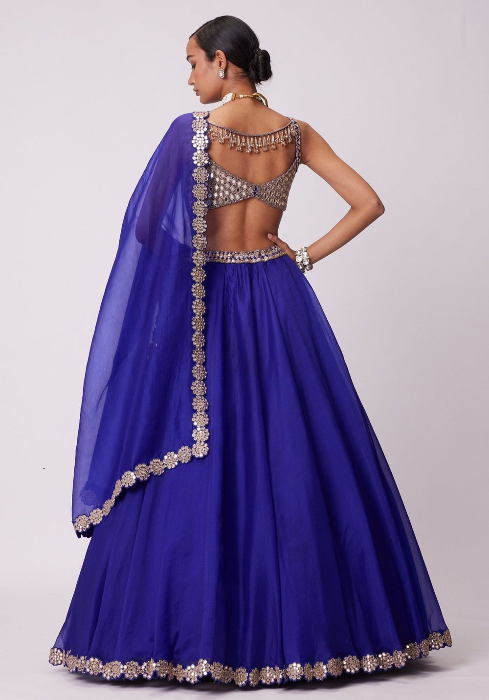 Blue Organza Lehenga With Embroidered Sleeveless Gold Blouse Vvani by Vani Vats - Fabilicious Fashion