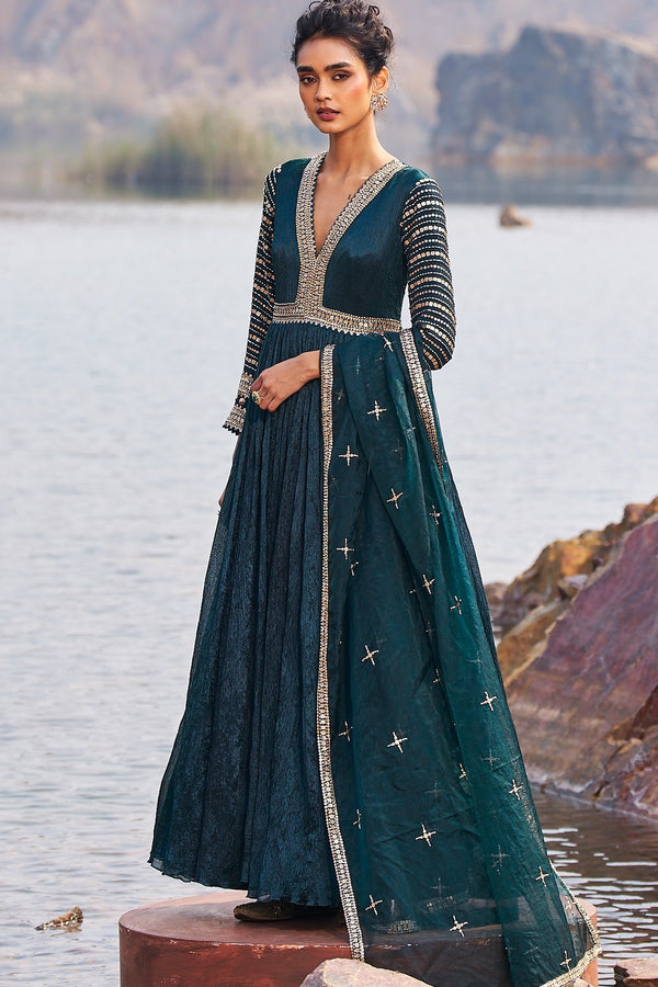 Emerald green and gold sequinned wedding guest anarkali for evening receptions by Nidhika Shekhar