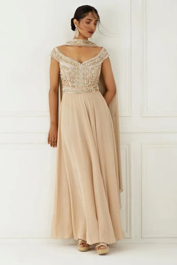 Champagne gold pearl and sequinned anarkali for daytime wedding guests by Nidhika Shekhar