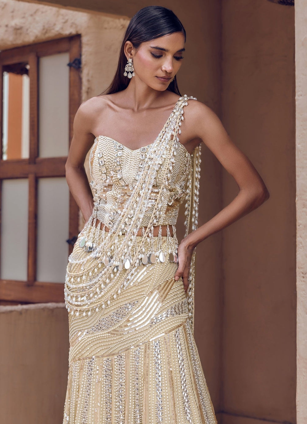 Nidhika Shekhar Champagne Pearl Georgette Pre-Draped Saree With CorsetFabilicious Fashion