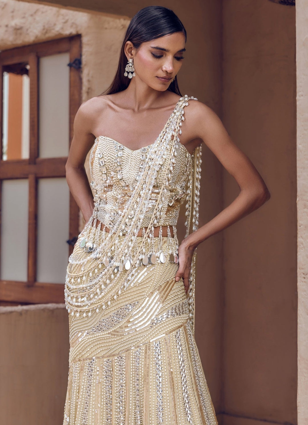 Nidhika Shekhar Champagne Pearl Georgette Pre-Draped Saree With CorsetFabilicious Fashion