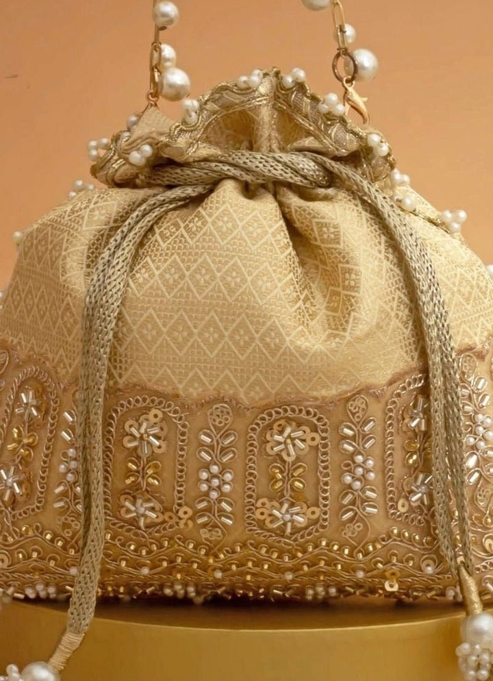Cream Silk Embroidered Potli Amyra - Fabilicious Fashion