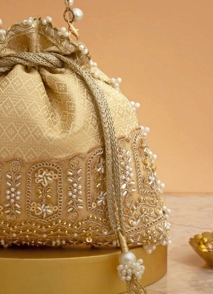 Cream Silk Embroidered Potli Amyra - Fabilicious Fashion
