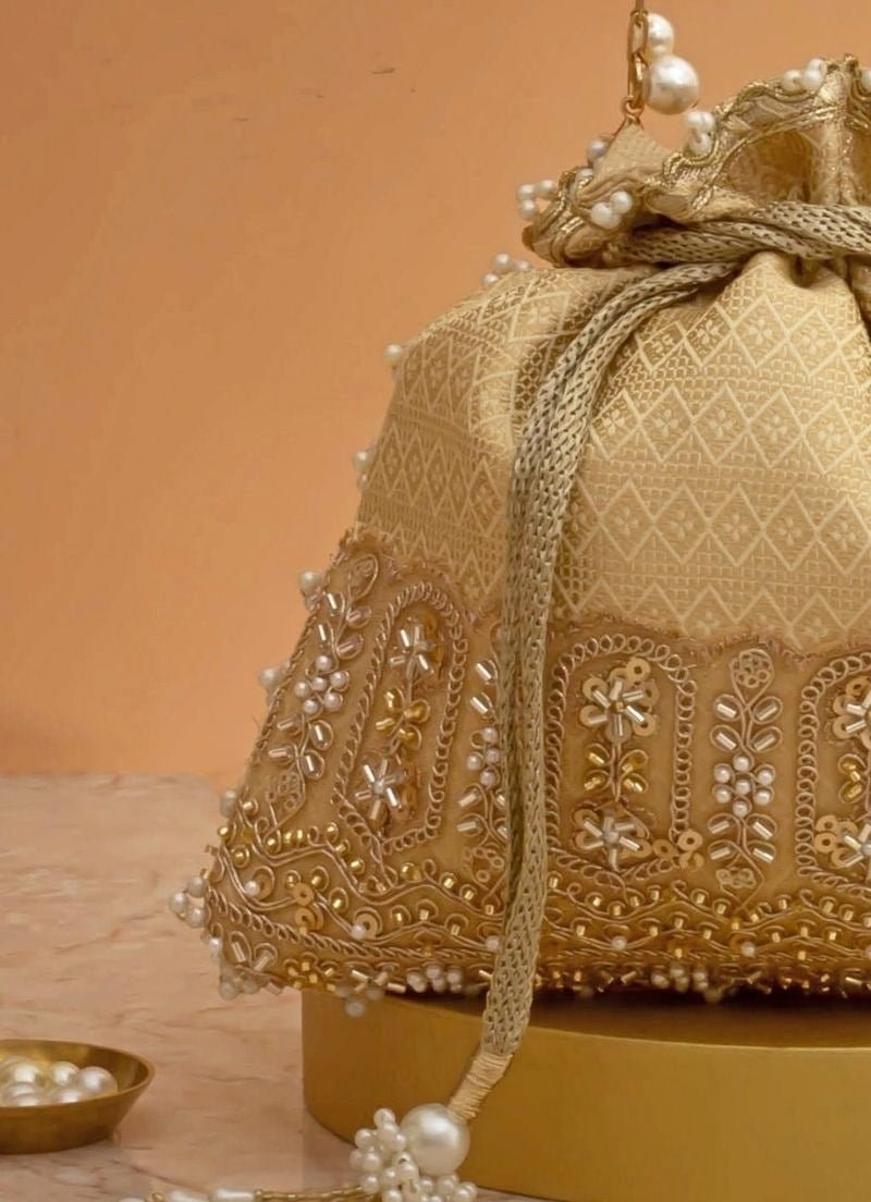 Cream Silk Embroidered Potli Amyra - Fabilicious Fashion