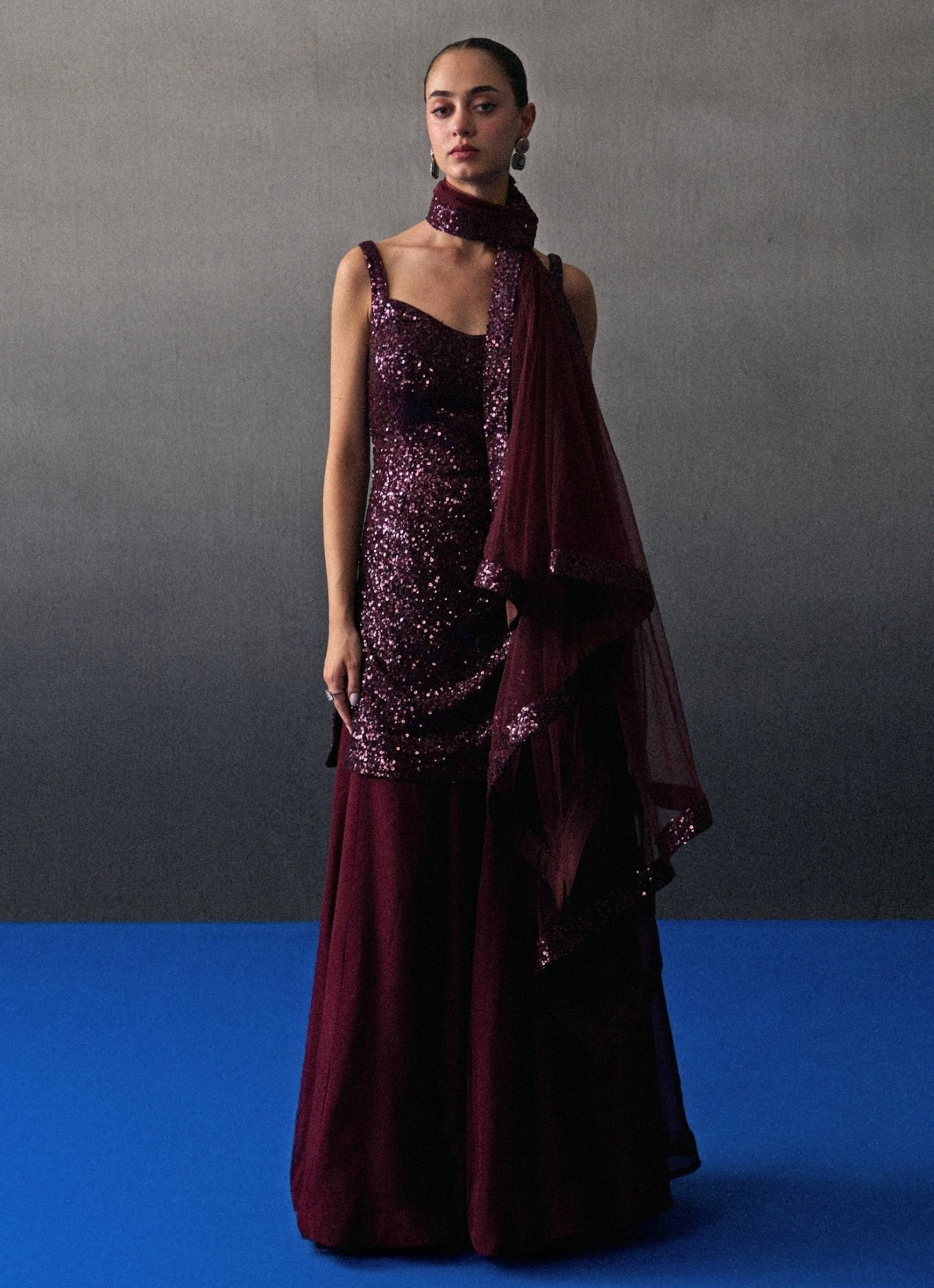 Crimson red sequins embroidered kurta sharara by Angad Singh — bold Sangeet outfit for diaspora brides