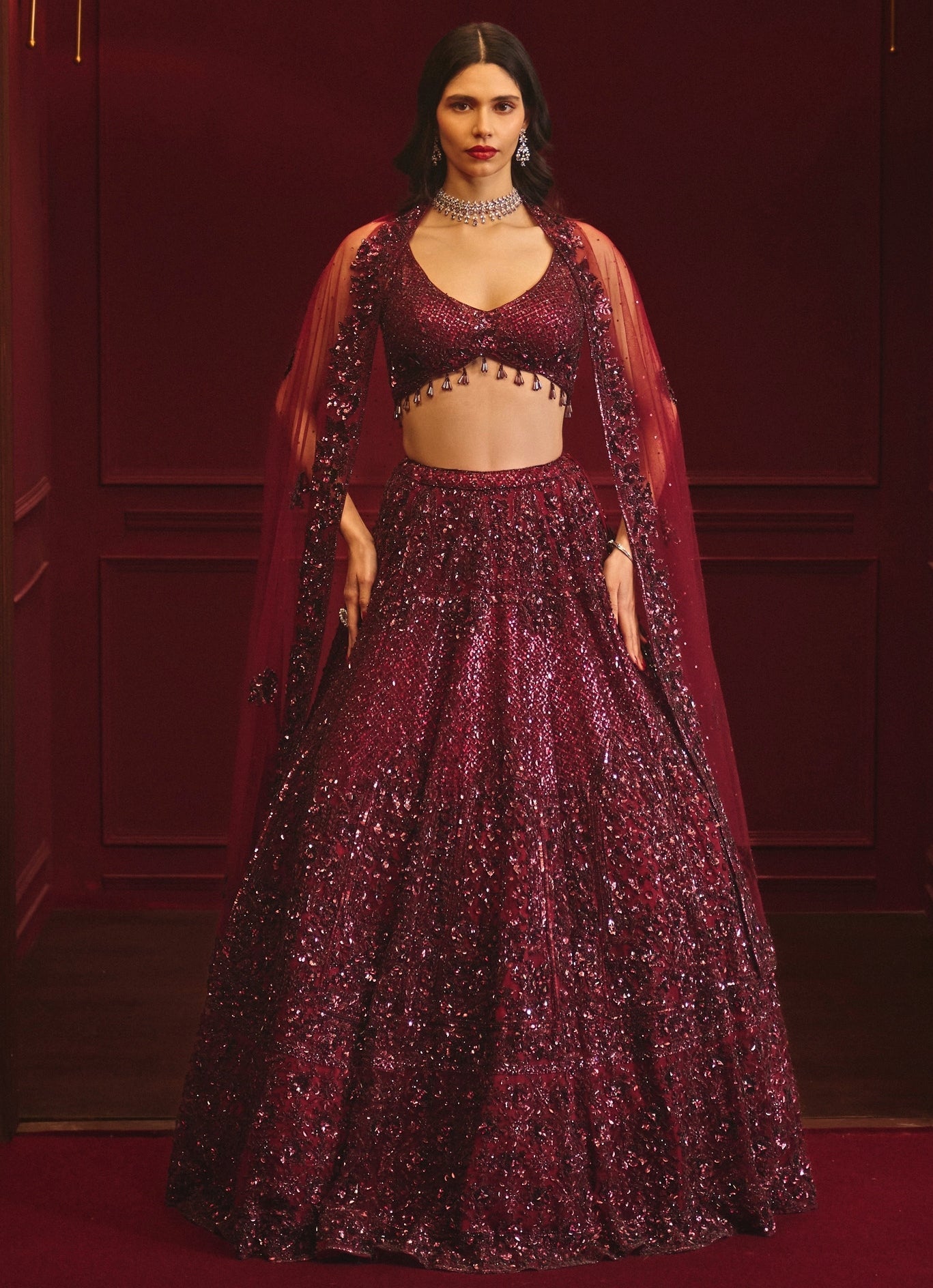Deep red soft net bridal lehenga by Angad Singh