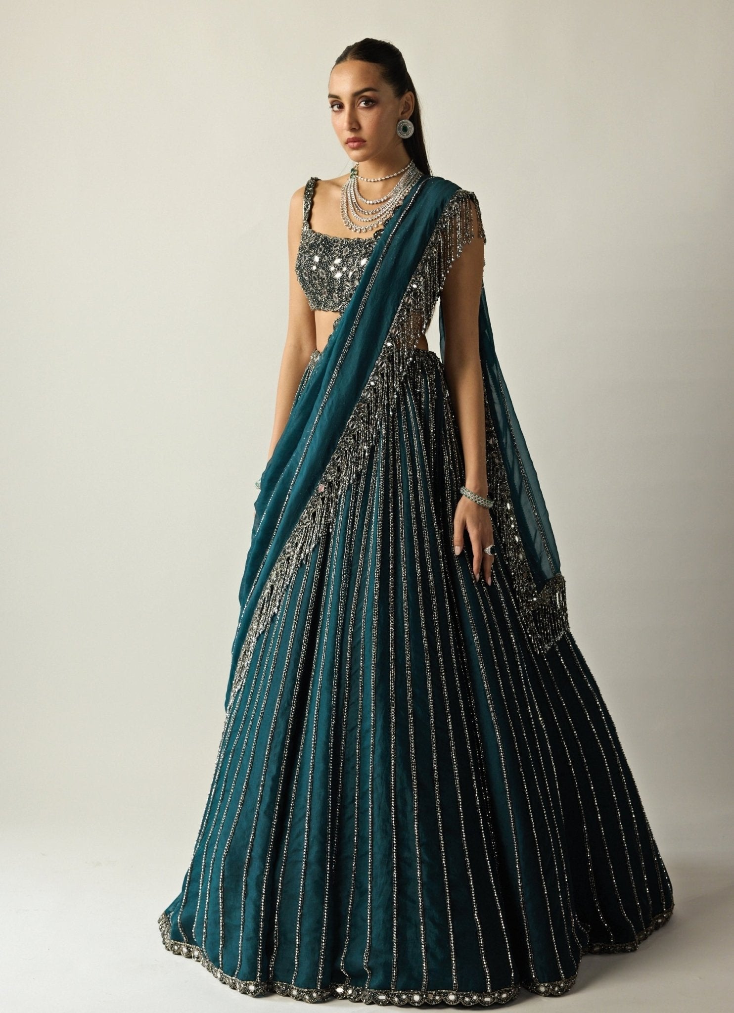 Dark teal green vani vats wedding guest lehenga