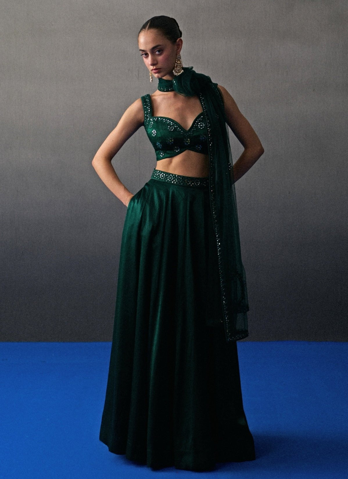 Emerald green satin silk lehenga set — wedding guest lehenga by Angad Singh