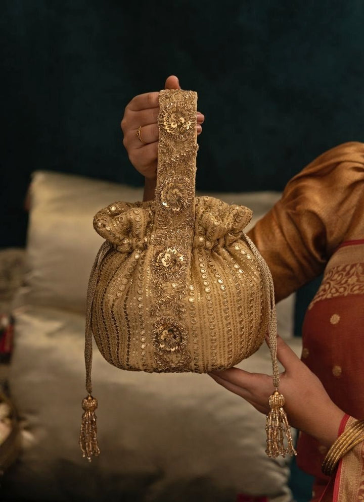 Amyra Gold Embroidered Georgette PotliFabilicious Fashion